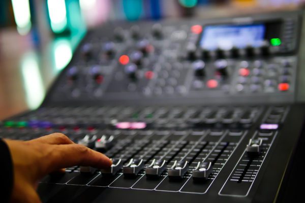 Audio mixing board demonstrating when to replace your audio visual system