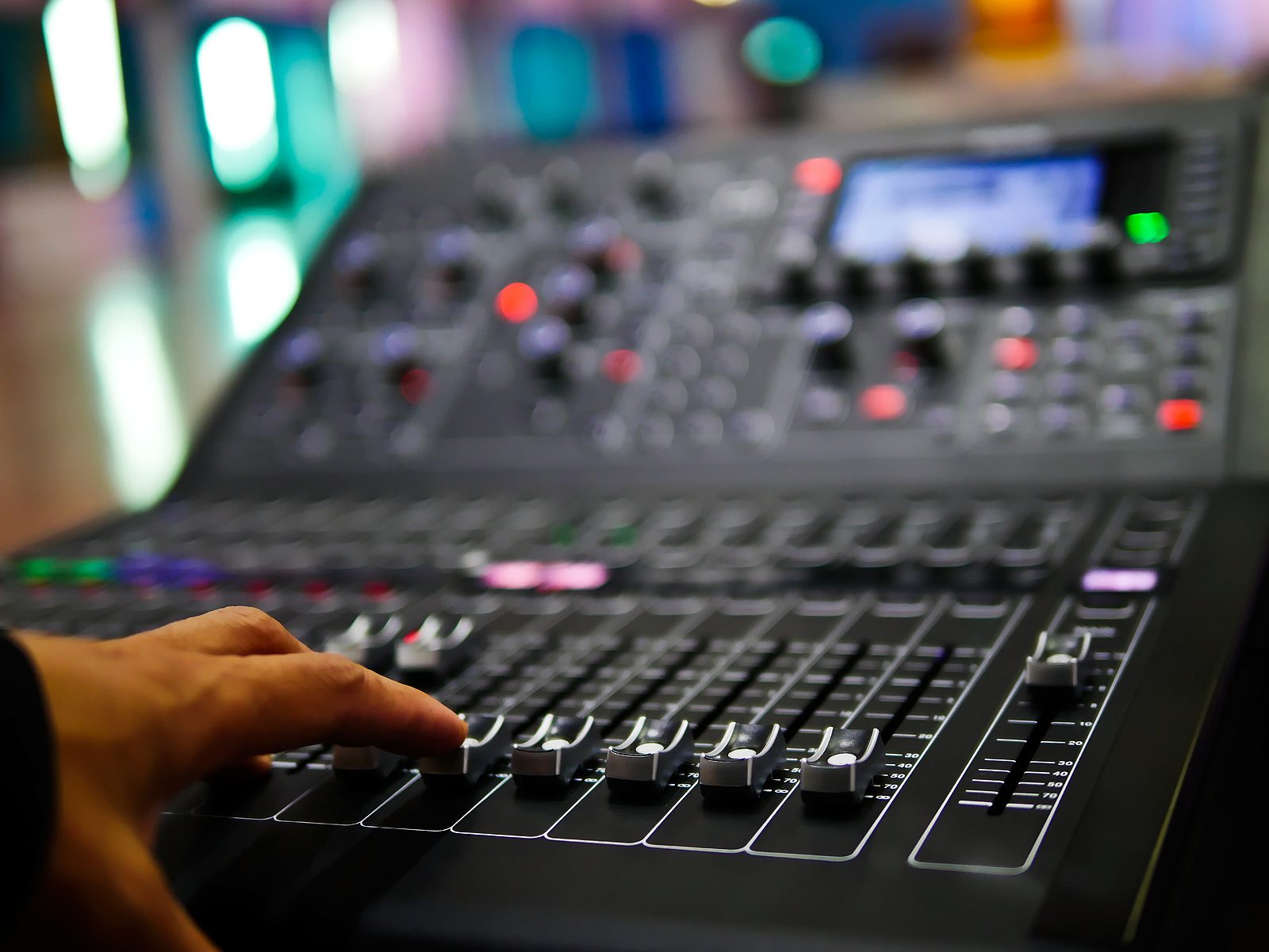 Audio mixing board demonstrating when to replace your audio visual system