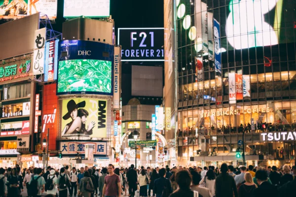 Japan in the night in a crowded street with video wall system
